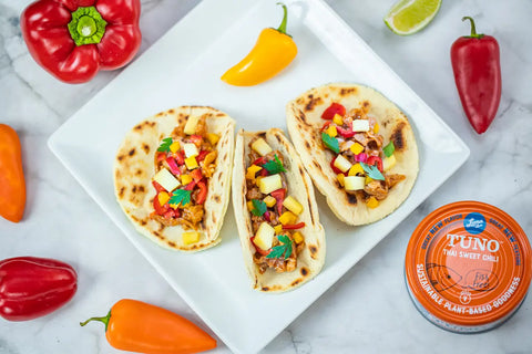 Loma Linda Thai Sweet Chili TUNO served on tacos with peppers and garnishments, vegan tuna alternative.