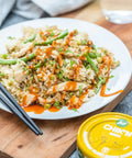 Loma Linda Chik’n Broth served in an Asian-style dish with rice, cut green beans, peas, and hot sauce, a plant-based vegan protein in a mild vegetable broth.