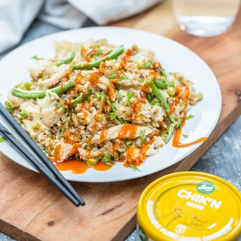 Loma Linda Chik’n Broth served in an Asian-style dish with rice, cut green beans, peas, and hot sauce, a plant-based vegan protein in a mild vegetable broth.