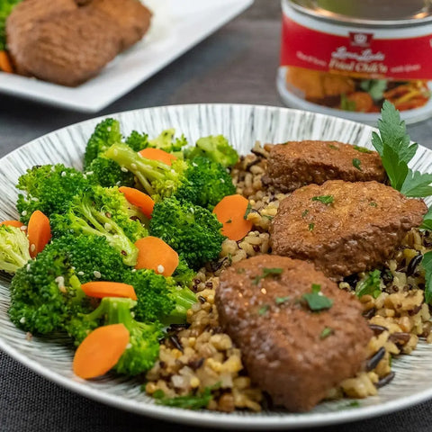 Loma Linda Frichik Original served with a broccoli and carrots medley, and rice.