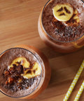 Kaffree Roma banana and chocolate smoothie in glasses, topped with chocolate, showcasing a creative use of this caffeine-free coffee alternative.