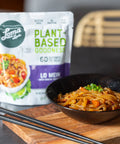 Lo Mein served with konjac noodles, bamboo shoots, carrots, and vegetables, vegan and gluten-free meal