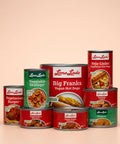 Front view of assorted Loma Linda Food cans in various sizes and varieties.