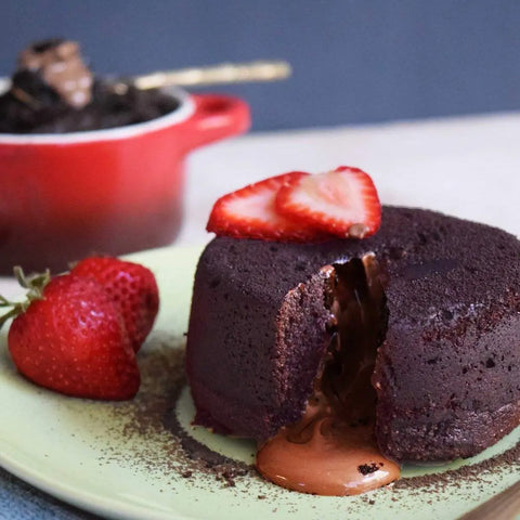 Chocolate cake topped with strawberries made using neat Egg, vegan egg replacement for baking.