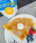 Crepes served with whipped cream and berries, made using neat Egg, plant-based egg replacement.