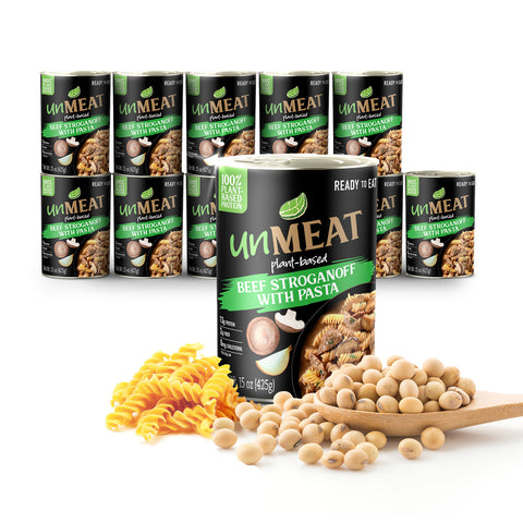 Twelve cans of 'UnMeat' plant-based beef stroganoff with pasta on a white background