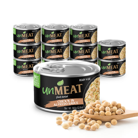 Twelve cans of 'unMEAT' plant-based chicken in Alfredo sauce with soybeans on a white background