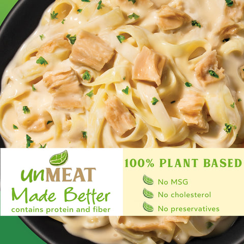 Noodles with chicken in a creamy alfredo sauce, labeled as 100% plant-based by 'unMEAT'.