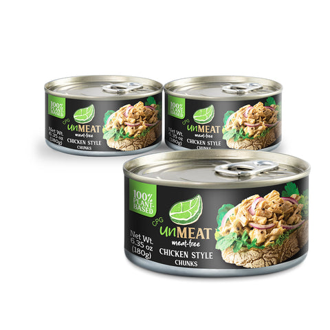 Three cans of UnMeat Chicken Style Chunks on a white background