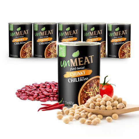 Six cans of UnMeat plant-based chunky chili with ingredients like beans and tomatoes on a white background