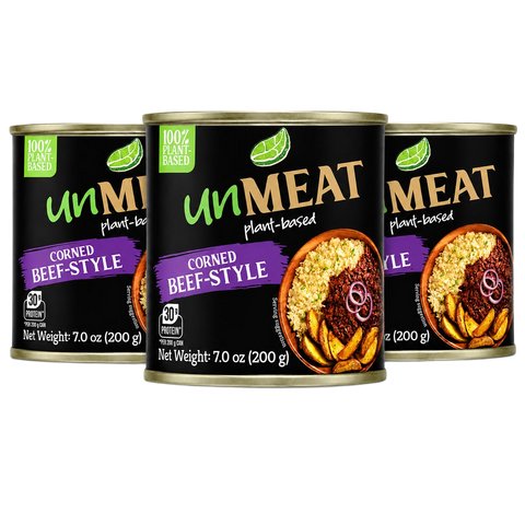 Three cans of 'Unmeat' corned beef style product on a white background