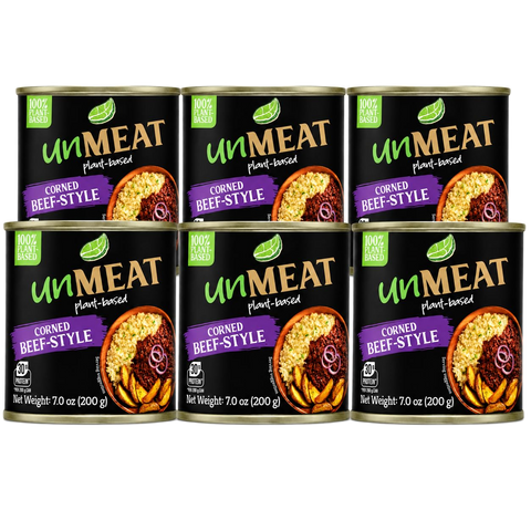 Six cans of 'unMEAT' corned beef style product on a white background