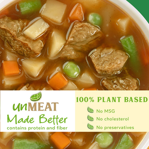 Bowl of country beef and vegetables soup with an 'unMEAT' label indicating it's plant-based.