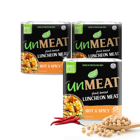 Three cans of 'unMEAT' plant-based luncheon meat hot and spicy flavor on a white background