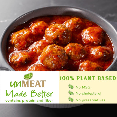 Dish of plant-based meatballs with sauce and 'unMEAT' branding and health benefits text.