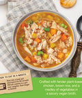 Bowl of roasted chicken and rice soup with vegetables and text about product details and heating instructions