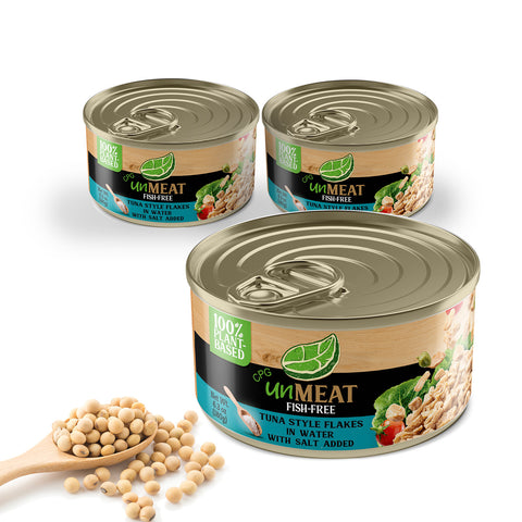 Three cans of UnMeat fish-free tuna in water with a scoop of soybeans on a white background