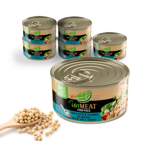 Six cans of UnMeat fish-free tuna in water with a scoop of soybeans on a white background