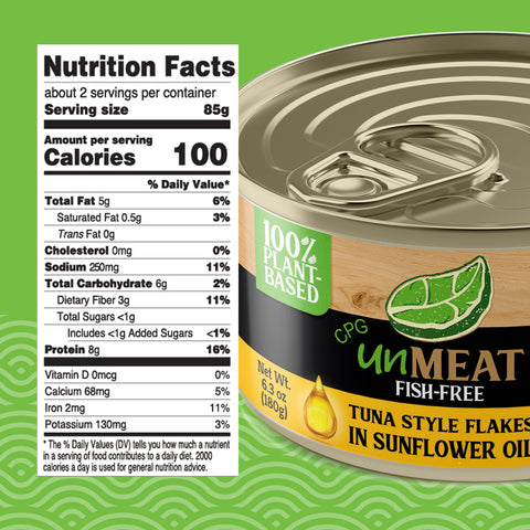 Can of tuna style flakes  in sunflower oil with nutrition label on a green background